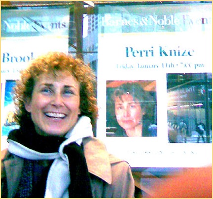 Perri poses with her poster at Barnes & Noble